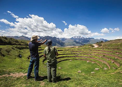 Two visitors looking at one of the sets of mysterious concentric circles found at Moray.