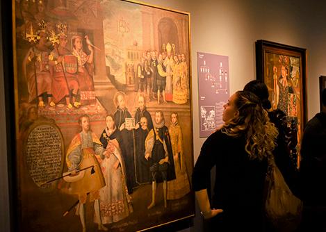 Visitors admiring a painting at the Pedro de Osma Museum, a private art museum in Lima.