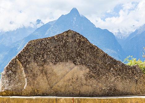 The Sacred Rock at Machu Picchu, whose shape bears a resemblance to the mountains behind it.