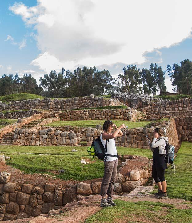 A pair of hikers setting off on a hike starting at the Chinchero ruins in the Sacred Valley.