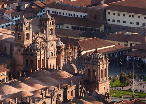 Aerial view of the historic colonial buildings surrounding Cusco's Plaza de Armas.