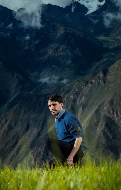 Virgilio Martinez, one of the world's best chefs, posing in a field in Peru's Sacred Valley.