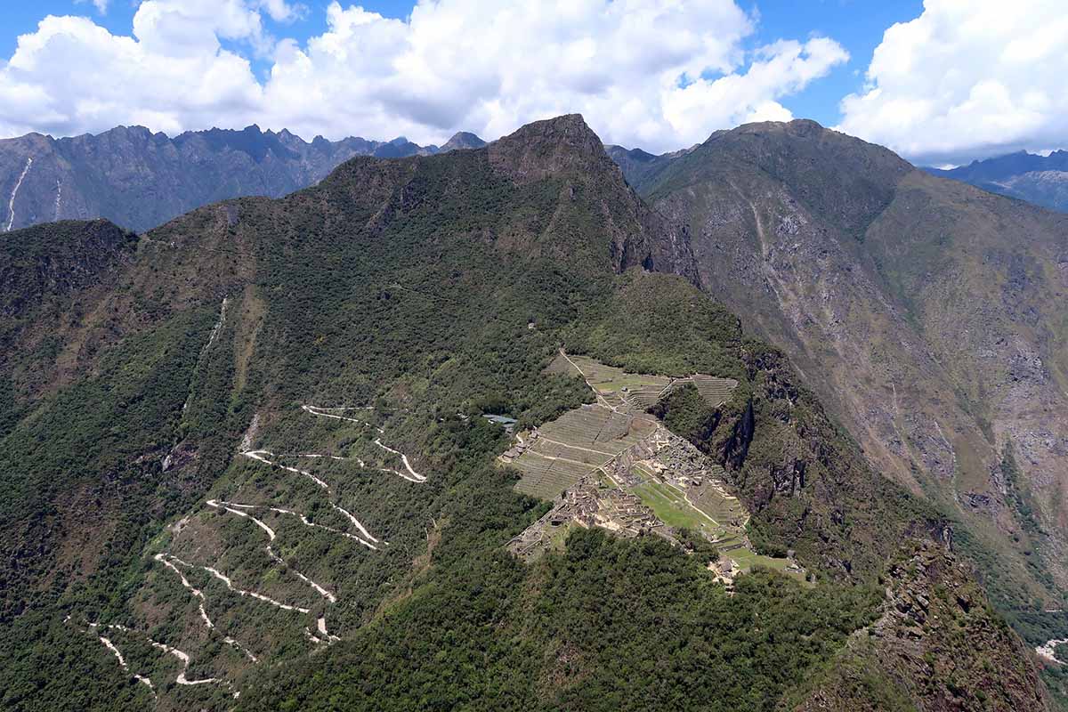 The view of Machu Picchu and the surrounding mountains from the top of Huayna Picchu on a clear day.