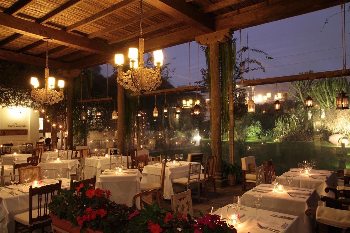 Romantic lighting and white table cloths of Cafe Larco with large windows overlooking the garden makes for a perfect honeymoon dinner.