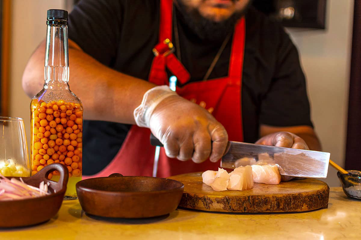 A chef prepares ceviche during a Peruvian cooking class in Lima.