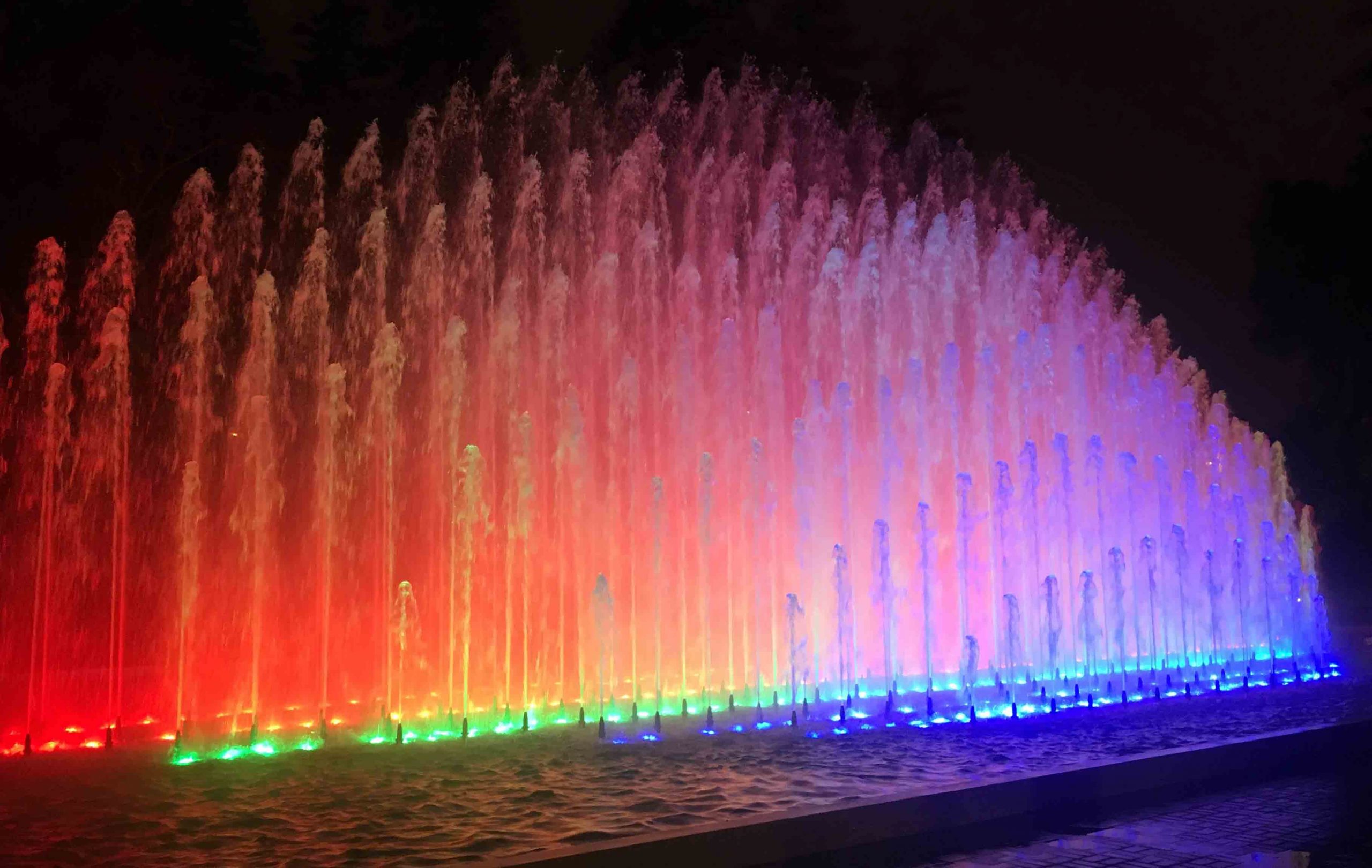 "Rainbow Fountain," one of Lima's Magic Water Circuit's thirteen illuminated fountains, lit up at night.