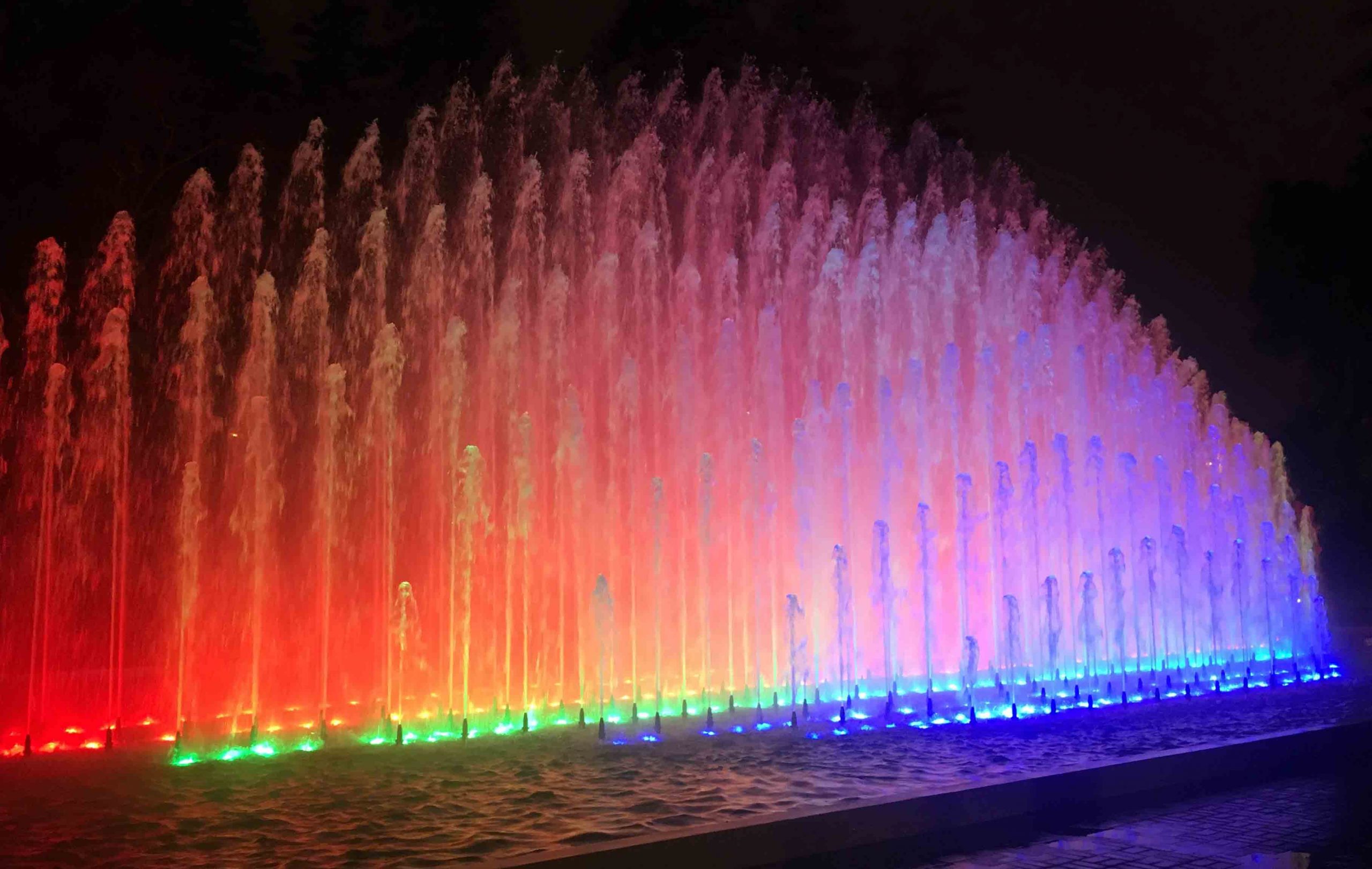 "Rainbow Fountain," one of Lima's Magic Water Circuit's thirteen illuminated fountains, lit up at night.