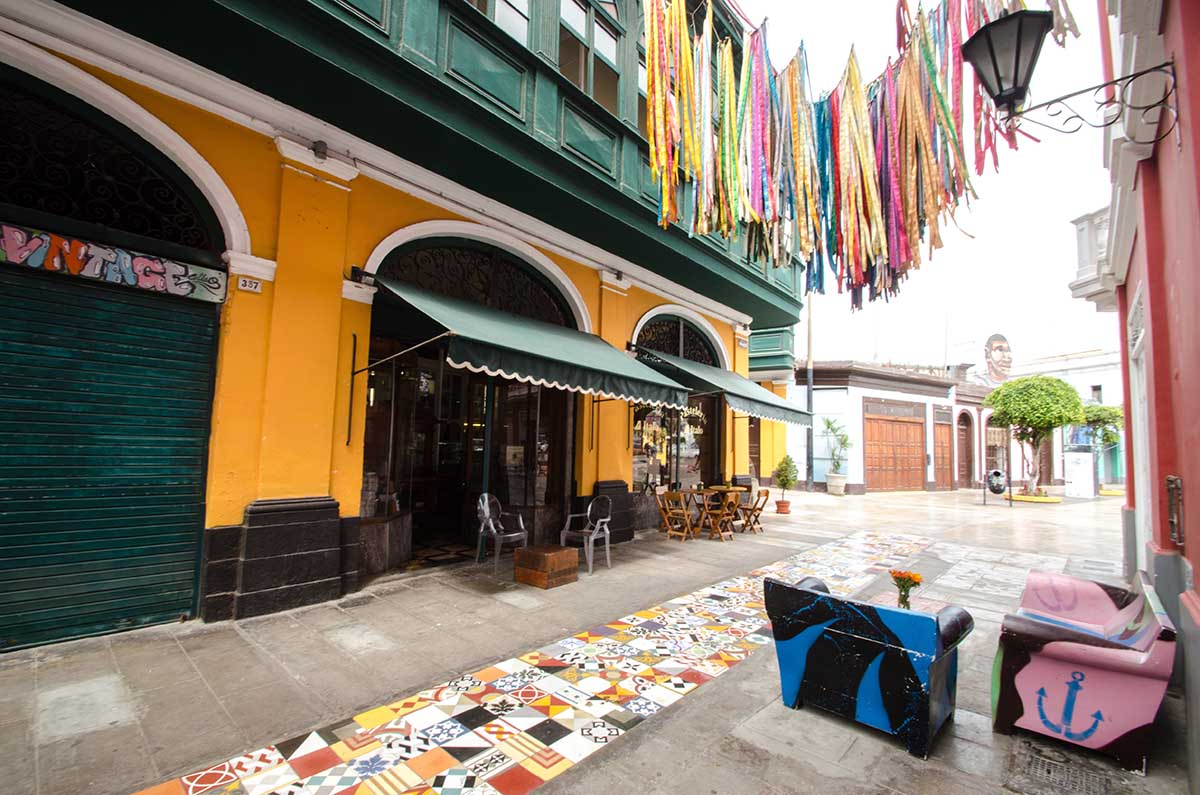 A walkway in Callao's historic district with examples of the colorful graffiti created through the Monumental Callao art association.