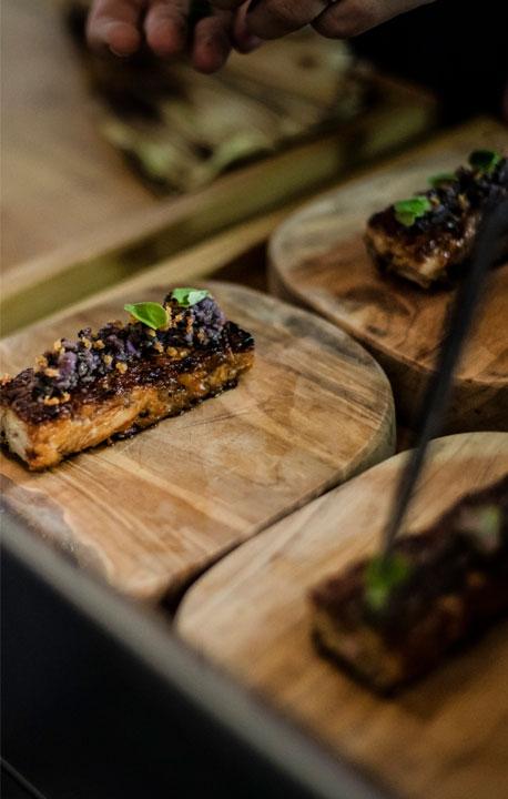 A dish served on a wooden cutting board at Mil Centro, located in Peru's Sacred Valley.